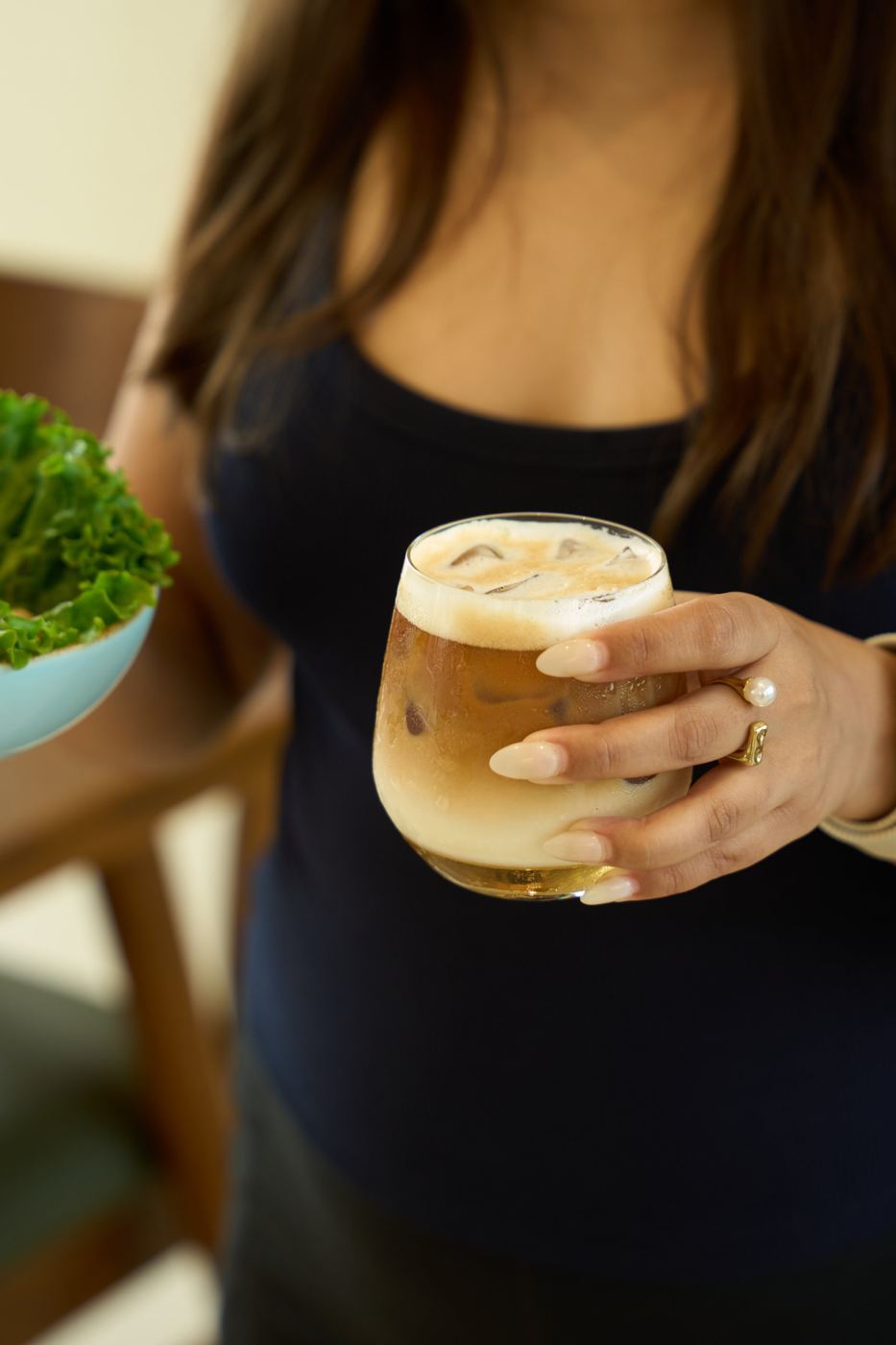 An iced latte held at the table