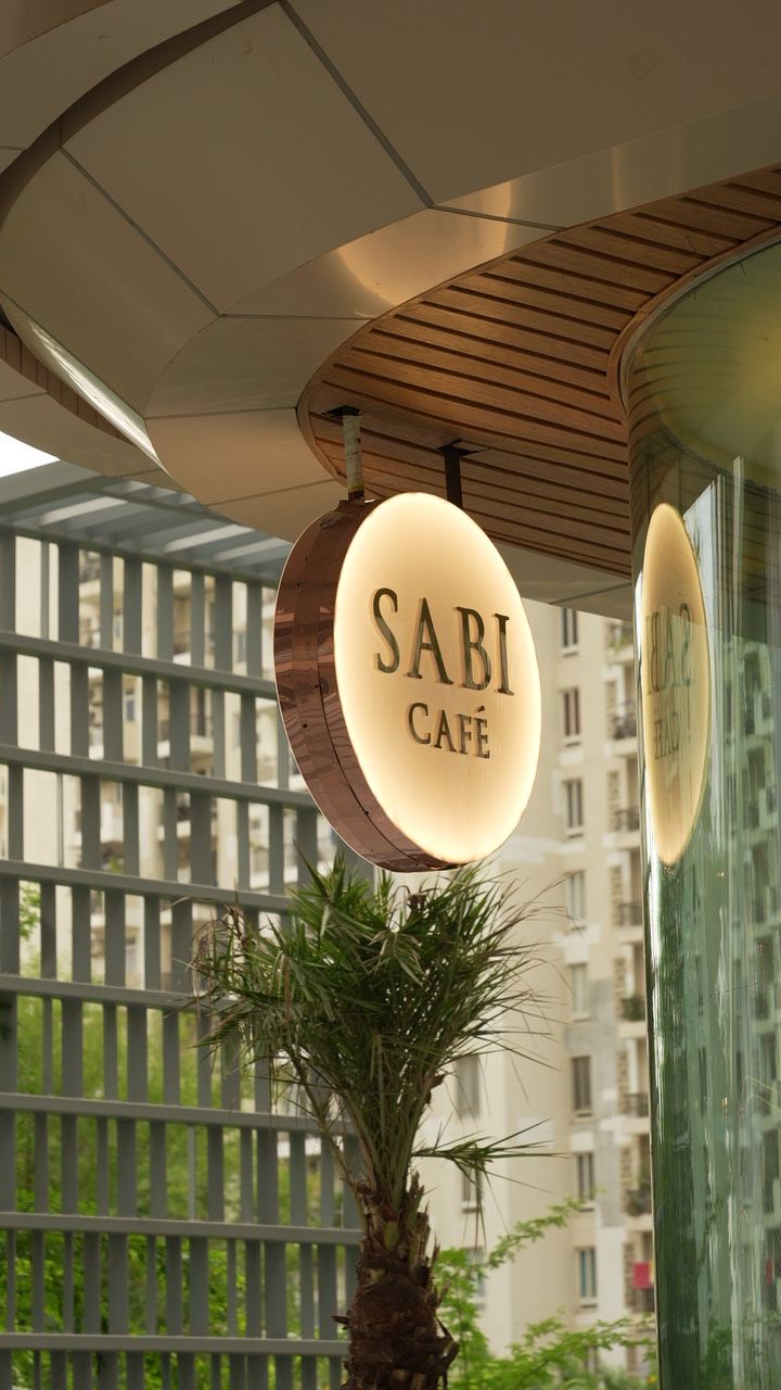 SABI Café round sign above the entrance