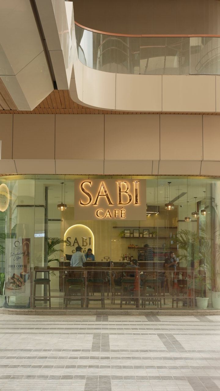 SABI Café storefront glowing at M3M Route 65