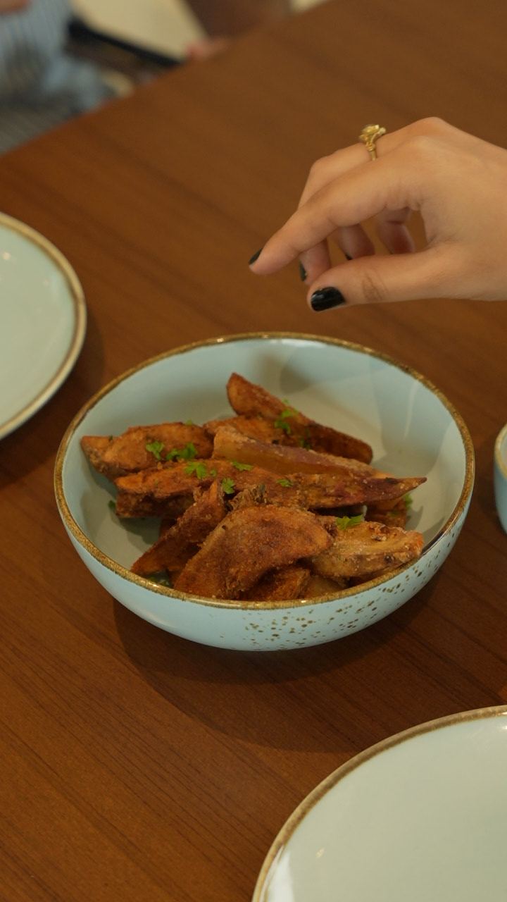 Sweet potato skins in a blue bowl